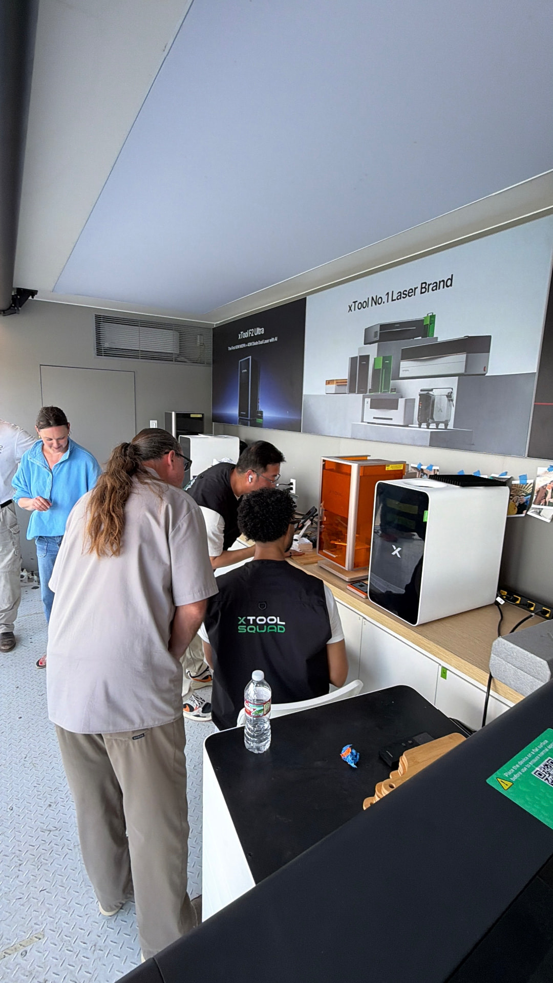 Group training session with xTool machines and demo host team