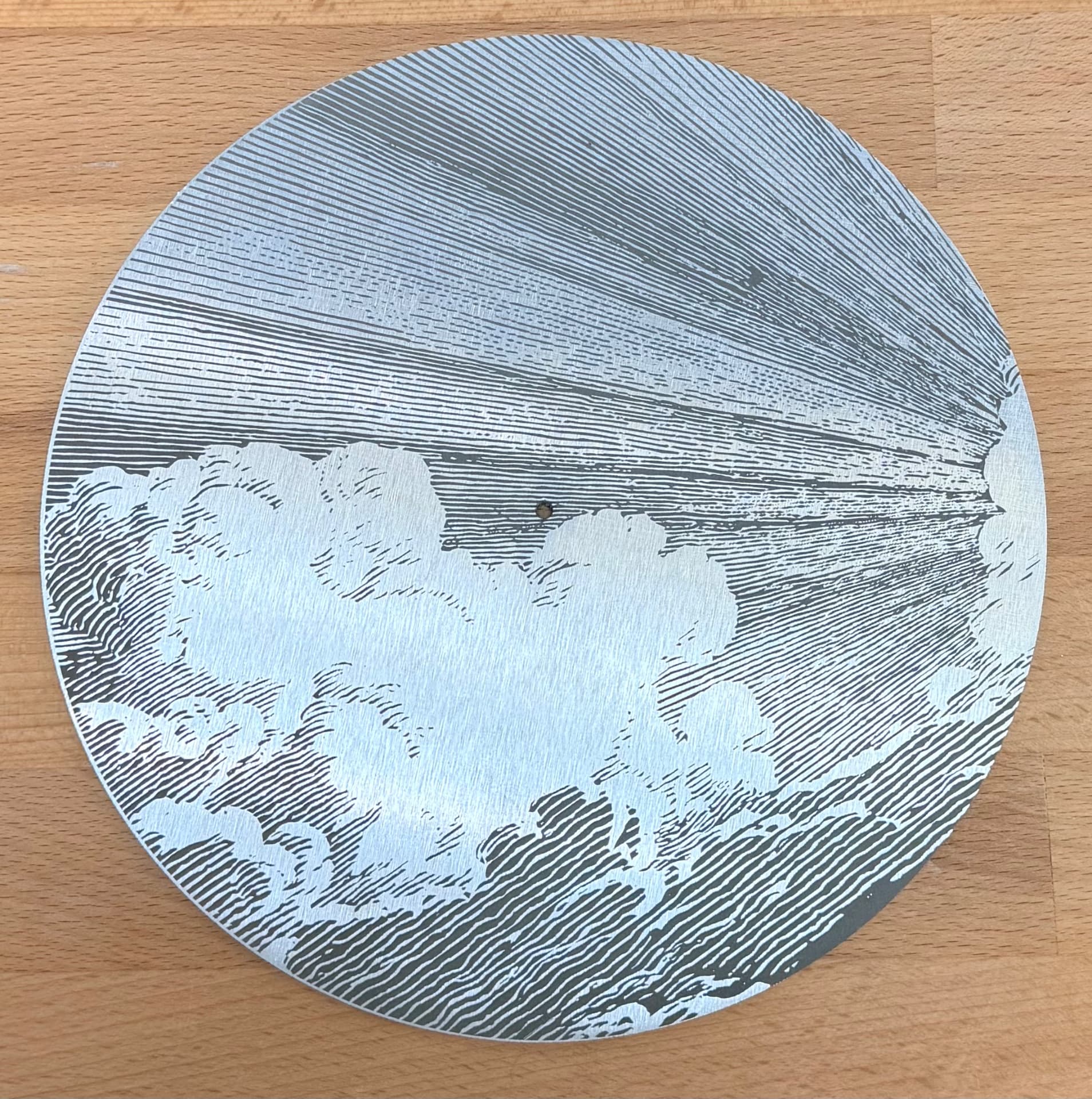 Fine cloud engraving in brushed aluminum