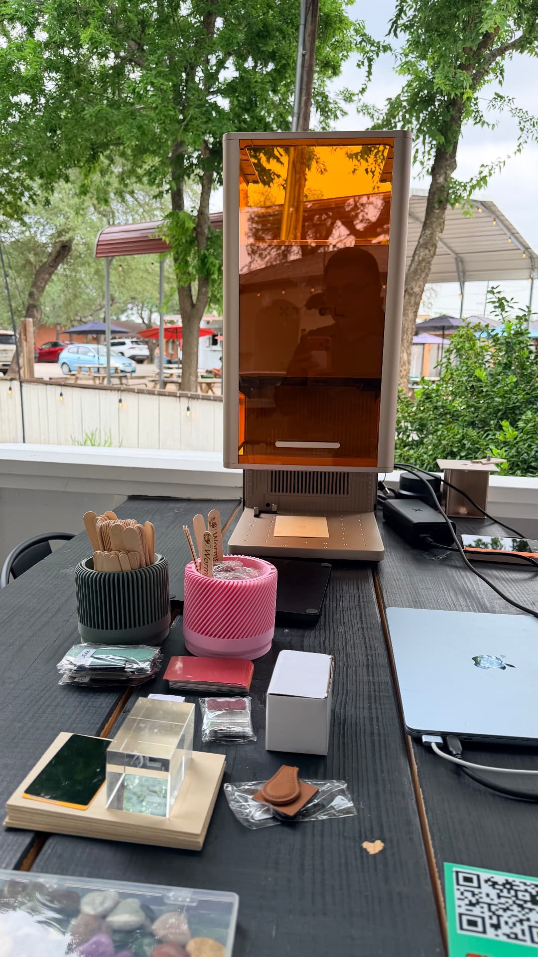 xTool P3 laser set up for a live demo with sample products and material swatches