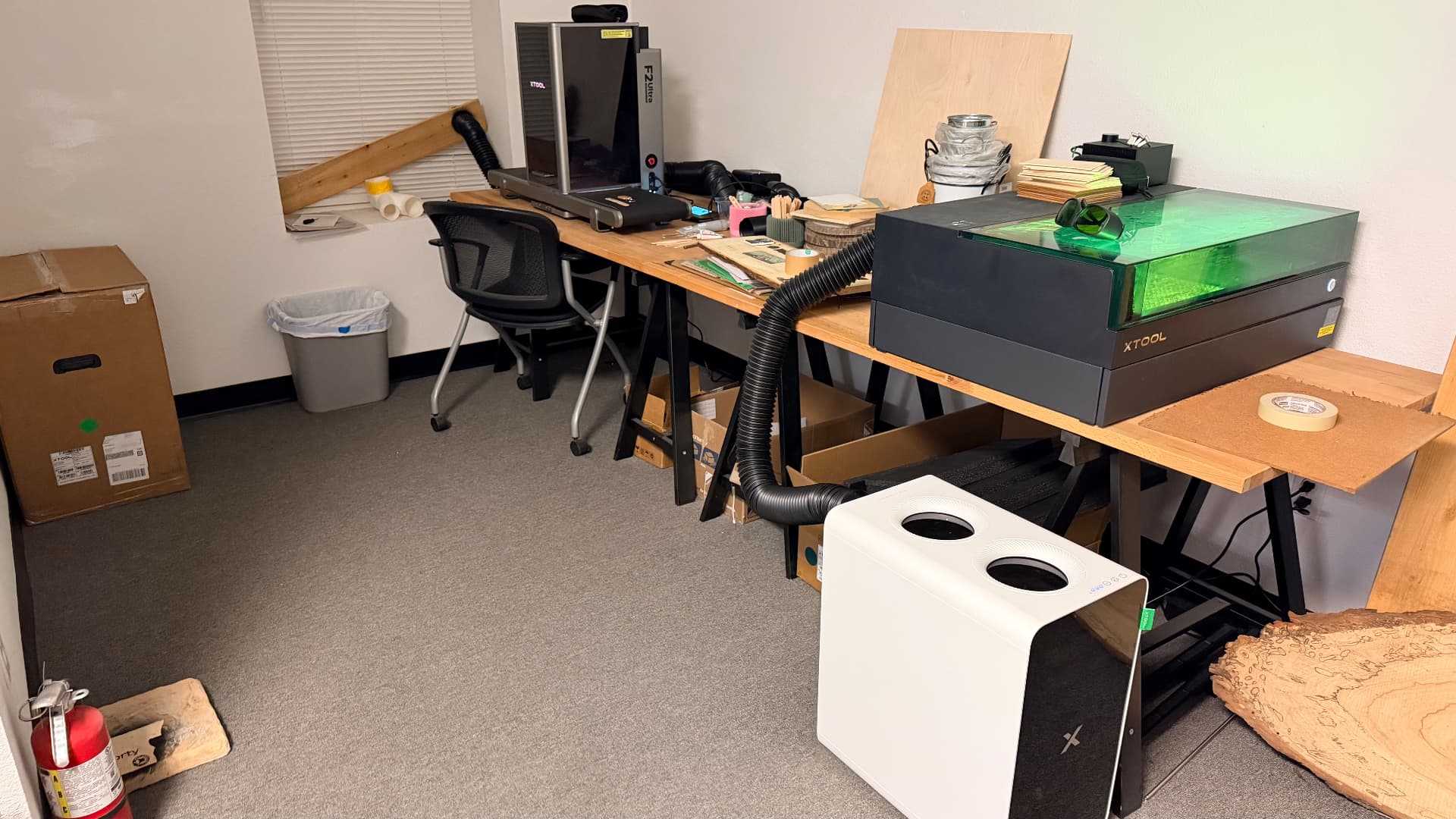 Maker Print Lab studio with xTool F2 Ultra and P3 laser systems on the bench