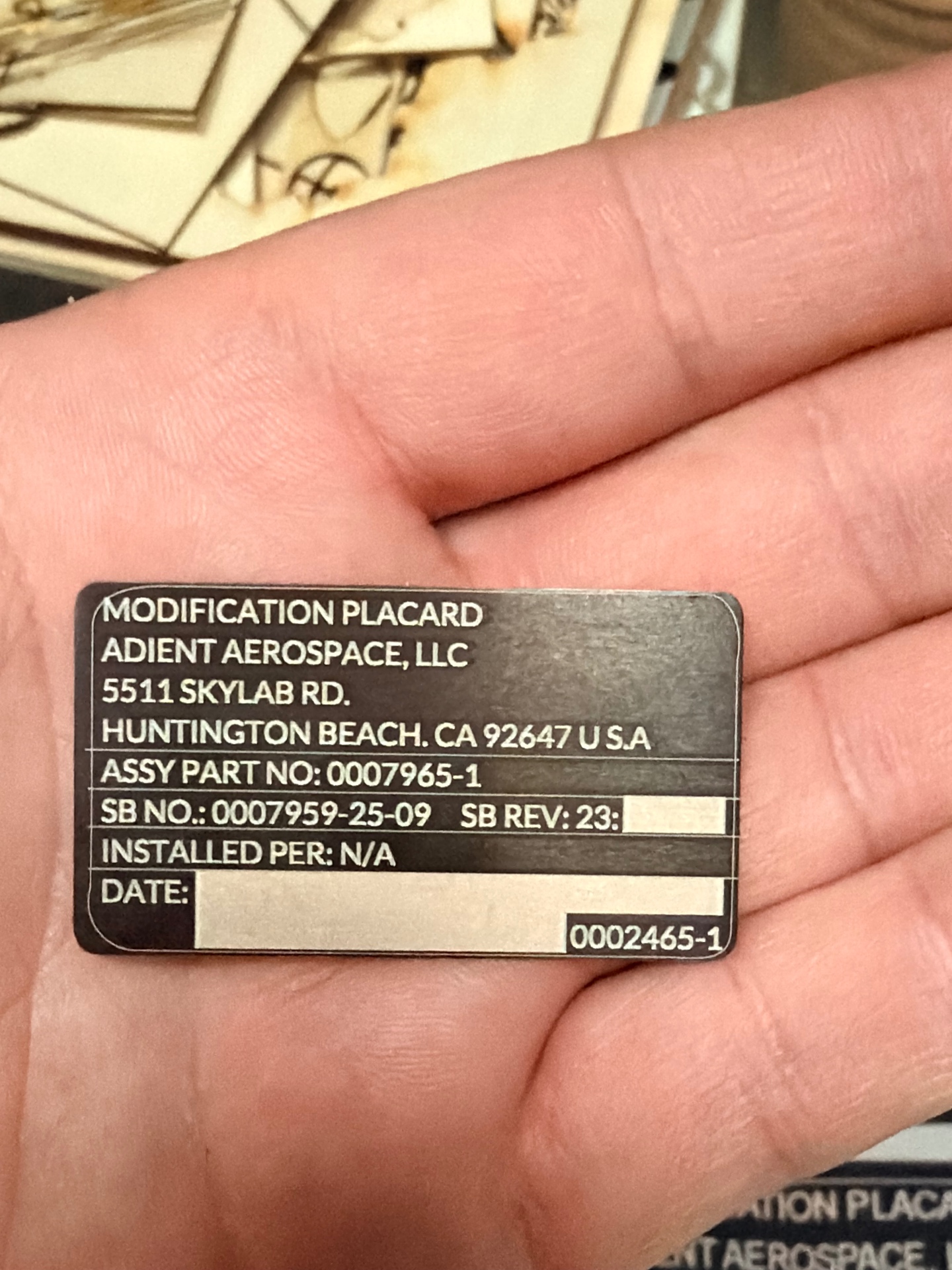 Engraved aerospace placard with fine serialised text