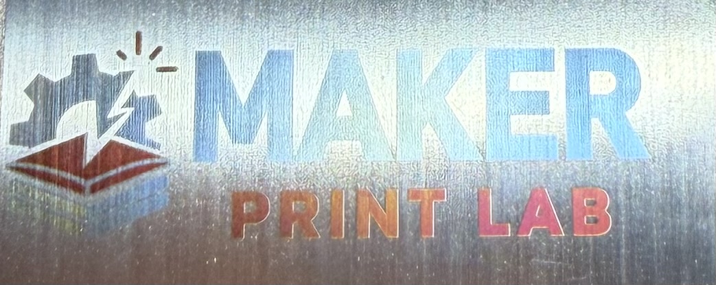 Full-color laser engraving of a logo on metal