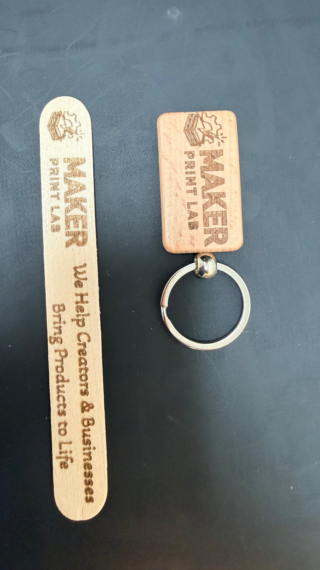 Laser cut wooden keychains and bookmarks with printed artwork